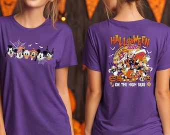 May include: A purple t-shirt featuring a front graphic of cartoon characters in Halloween costumes with spiderwebs and a back graphic with the text HALLOWEEN 2026 ON THE HIGH SEAS, depicting characters in pirate costumes with pumpkins and a ship wheel.