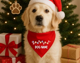 May include: A golden retriever puppy wearing a red Santa hat and a red bandana. The bandana has a string of colorful paw prints and the text "DOG NAME". The dog is in front of a Christmas tree and wrapped gifts.