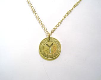 Vintage brass subway token necklace