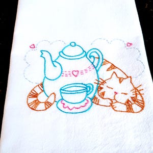 Vintage style tea towel hand embroidered with a cat and teapot