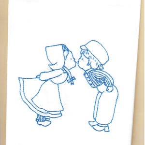 Vintage style tea towel hand embroidered with a Dutch boy and girl