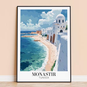 May include: A white building with a blue domed roof sits on a cliff overlooking a turquoise ocean. The building is surrounded by white walls and a sandy beach. The text "MONASTIR TUNISIA" is printed below the image.