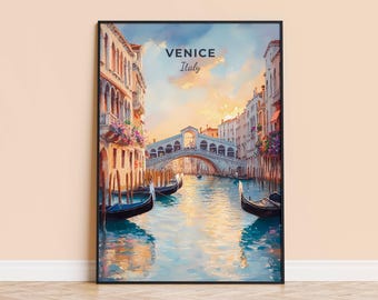 May include: Framed art print of Venice, Italy, featuring a canal scene with gondolas, a bridge, and buildings. The artwork has a watercolor style with warm colors, including orange, blue, and brown. The text "VENICE Italy" is at the top.