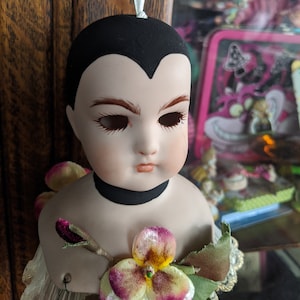 Voodoo doll hanging head