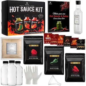 May include: A hot sauce kit with a recipe book, seasonings, and vinegar. The kit includes bottles, pepper flakes, and gloves. The box features the text "Make Your Own Hot Sauce Kit" with images of jalape&ntilde;o, habanero, and chipotle peppers.