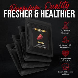May include: Black pouches of Ghost Peppers with the text "Premium Quality, Fresher & Healthier." Each pouch has a label with a red pepper illustration. The label also states "Net Wt. 0.2oz (5g)." Additional text includes "No Harmful Chemicals" and "Designed With Love In USA."