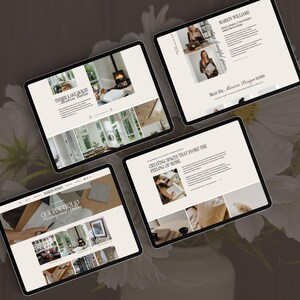 May include: Four digital tablets displaying a website for Marion Design. The screens show interior design portfolios, team biographies, and project descriptions with text headers like Fisher Lake House, Our Portfolio, and Creating Spaces That Evoke The Feeling Of Home.