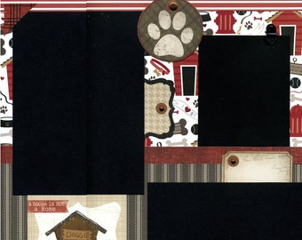 May include: A scrapbook page with a black and white dog paw print, a red and white dog house, and a black and white dog bone pattern. The text "a house is not a home without a dog" is printed on the page.