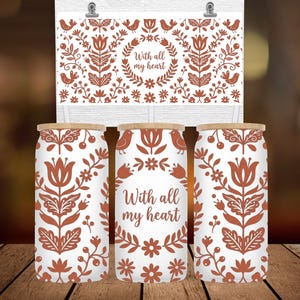 May include: White glass beverage containers with a floral design in shades of brown. The design includes flowers, birds, and the text "With all my heart." The containers have wooden lids. A matching decorative print is displayed above the containers.