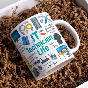 May include: White ceramic mug with the words "IT Technician Life" and various tech-related illustrations. The mug includes text such as "Have you tried turning it off and on again?" and "Ctrl+Alt+Fix Everything."
