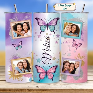 May include: A set of three personalized tumblers with butterfly and photo designs. Each tumbler features a different color scheme, with butterflies, stars, and framed photos. The name "Melisa" is written on one of the tumblers. Includes a "6 Free Design Gift" label.