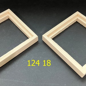 May include: Two unfinished wooden picture frames, both with a simple rectangular shape and a slightly raised edge. The frames are 124 by 18 inches.
