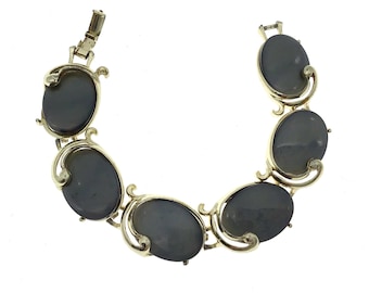 Pulsera vintage Moonglow de termoestable: cabujones grises y biseles dorados