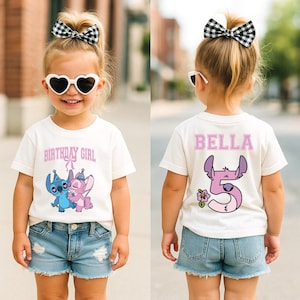 May include: A white t-shirt with the text "BIRTHDAY GIRL" and a cartoon image of two characters. The back of the shirt has the name "BELLA" and the number "5" with a cartoon character design. The child is wearing denim shorts.