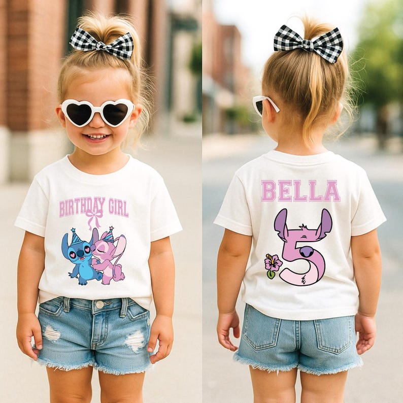 May include: A white t-shirt with the text "BIRTHDAY GIRL" and a cartoon image of two characters. The back of the shirt has the name "BELLA" and the number "5" with a cartoon character design. The child is wearing denim shorts.