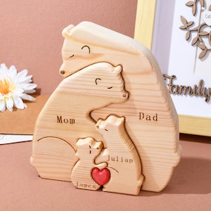 May include: Wooden bear family puzzle with the names Mom, Dad, Julian, and James engraved on each bear. The bears are arranged in a hug with a red heart in the center.