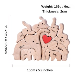 May include: Wooden puzzle with eight elephants, each with a different name, forming a heart shape. The puzzle is 11.7 inches tall and 5.9 inches wide. The elephants are made of natural wood and have a light brown color.