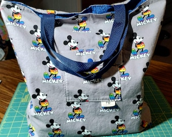 Gray Tote with Mickey Mouse Print - snap closure, snapping outer pocket, inner pocket, fully lined.