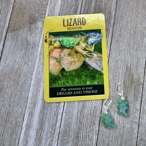 May include: Green and blue lizard on a yellow card with the text "Lizard Dreamtime" and "Pay attention to your DREAMS AND VISIONS".  Two green lizard shaped earrings with silver hooks.