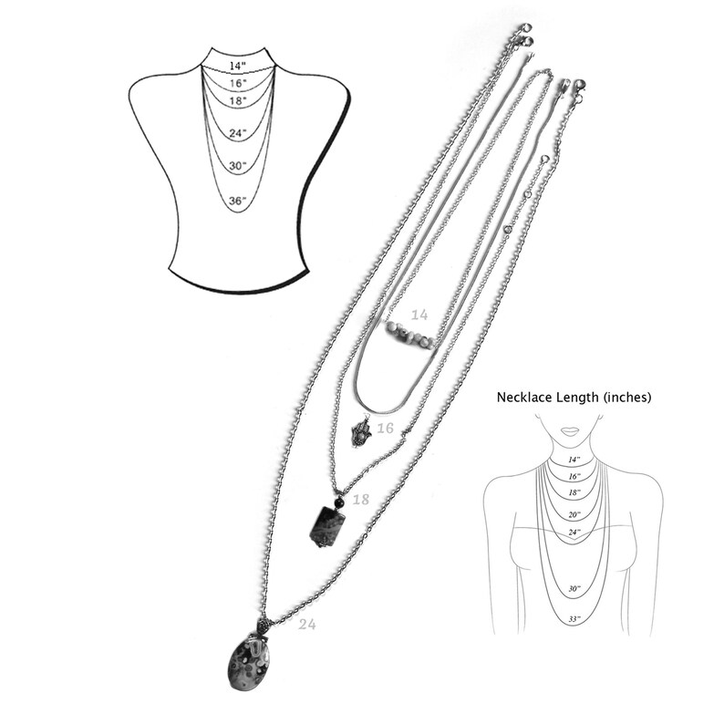 May include: A set of four silver chain necklaces with different pendant styles. The necklaces are layered and shown on a mannequin. The necklaces are available in lengths of 14, 16, 18, and 24 inches.