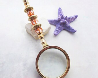 GOLD MAGNIFYING GLASS - Magnifier glass, golden faceted glass, orange beads, gift for grandparent, beaded handle magnifier