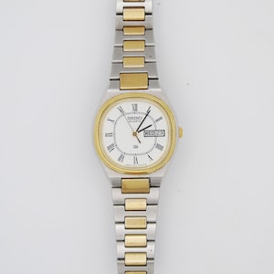Seiko Ladies Watch Two tone Gold and Silver Tone Quartz Japanese Wristwatch Day Date Function