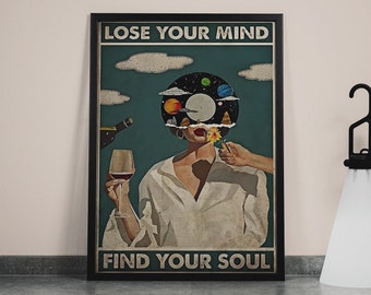May include: A vintage-style poster with a woman holding a glass of wine. The woman's head is replaced with a record with planets and stars on it. The poster says "Lose Your Mind Find Your Soul".