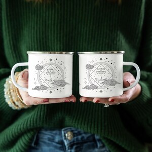 12oz enamel mug with celestial dragon design inspired by Fourth Wing and fantasy books. Perfect for Rebecca Yarros fans, book lovers, and dragon enthusiasts. Features mystical patterns, constellation-inspired art, and cozy aesthetics. Ideal fantasy merch for romantasy and Empyrean series fans. Great for bookstagram, cozy mornings, camping, or gifting. Tags: dragon aesthetic, fantasy mug, Fourth Wing merch, bookish decor, dragon gift, fantasy lover gift, booktok trending.