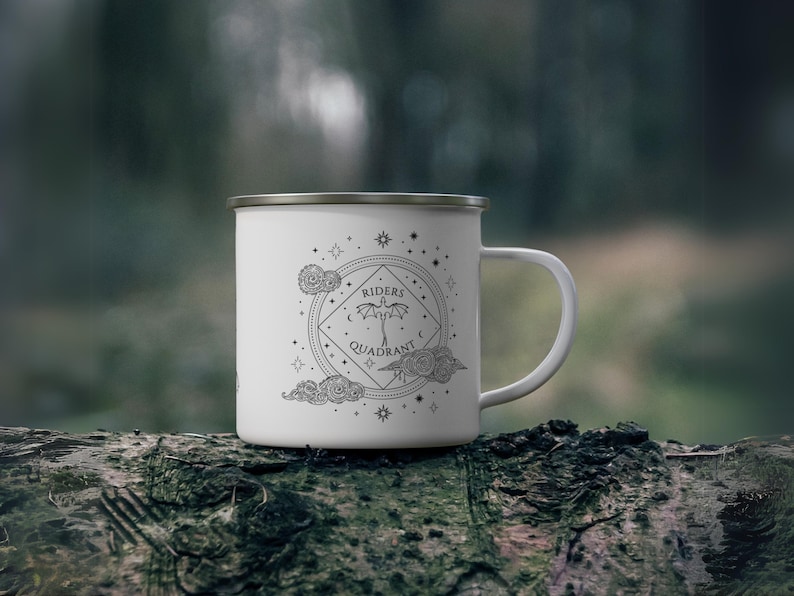 12oz enamel mug with celestial dragon design inspired by Fourth Wing and fantasy books. Perfect for Rebecca Yarros fans, book lovers, and dragon enthusiasts. Features mystical patterns, constellation-inspired art, and cozy aesthetics. Ideal fantasy merch for romantasy and Empyrean series fans. Great for bookstagram, cozy mornings, camping, or gifting. Tags: dragon aesthetic, fantasy mug, Fourth Wing merch, bookish decor, dragon gift, fantasy lover gift, booktok trending.