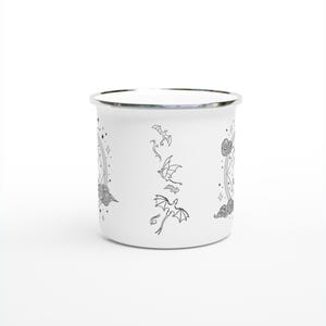 12oz enamel mug with celestial dragon design inspired by Fourth Wing and fantasy books. Perfect for Rebecca Yarros fans, book lovers, and dragon enthusiasts. Features mystical patterns, constellation-inspired art, and cozy aesthetics. Ideal fantasy merch for romantasy and Empyrean series fans. Great for bookstagram, cozy mornings, camping, or gifting. Tags: dragon aesthetic, fantasy mug, Fourth Wing merch, bookish decor, dragon gift, fantasy lover gift, booktok trending.
