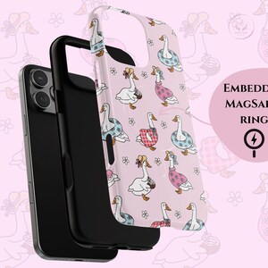 Pastel pink phone case featuring whimsical geese in summer outfits, pink gingham, daisies, coquette aesthetic, cottagecore vibes, retro floral design, vintage charm, dreamy summer style, ribbon bows, botanical patterns, playful aesthetic, nature-inspired, trendy MagSafe case, chic phone accessory, cute animal design, feminine aesthetic, modern summer fashion, ideal for aesthetic lovers, whimsical decor, cottagecore accessories, trendy pastel phone case for summer vibes.