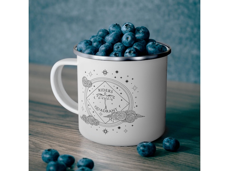12oz enamel mug with celestial dragon design inspired by Fourth Wing and fantasy books. Perfect for Rebecca Yarros fans, book lovers, and dragon enthusiasts. Features mystical patterns, constellation-inspired art, and cozy aesthetics. Ideal fantasy merch for romantasy and Empyrean series fans. Great for bookstagram, cozy mornings, camping, or gifting. Tags: dragon aesthetic, fantasy mug, Fourth Wing merch, bookish decor, dragon gift, fantasy lover gift, booktok trending.