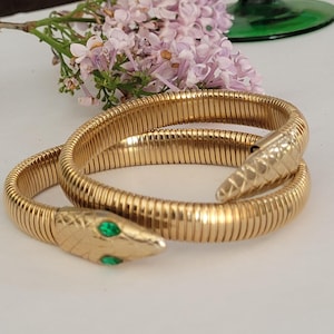 Vintage snake cuff  bracelet goldtone with green eyes
