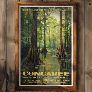 May include: A vintage-style poster for Congaree National Park, established in 2003. The poster features a scenic view of a cypress swamp with tall trees and still water. The text "Congaree National Park" is in large, bold letters, with the park's logo and the U.S. Department of the Interior logo below.