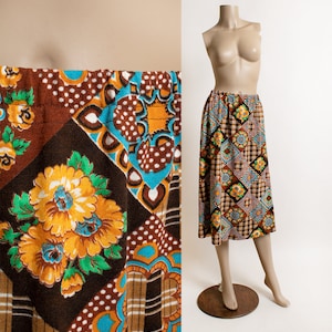May include: A brown, blue, and yellow patterned skirt with a high waist and a straight silhouette. The skirt is made of a soft, comfortable fabric and has a vintage feel.