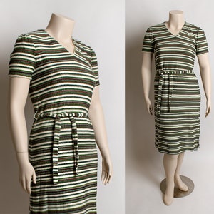 May include: A striped dress with a V-neck and short sleeves. The dress has a brown, green, and white striped pattern and a matching belt.
