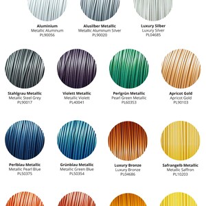 May include: A chart of 12 different metallic colors of filament for 3D printing. The colors include aluminum, steel grey, pearl blue, aluminum silver, violet, pearl green, green blue, bronze, apricot gold, saffron, red copper, and red. Each color is labeled with its name, a description of the color, and a product code.