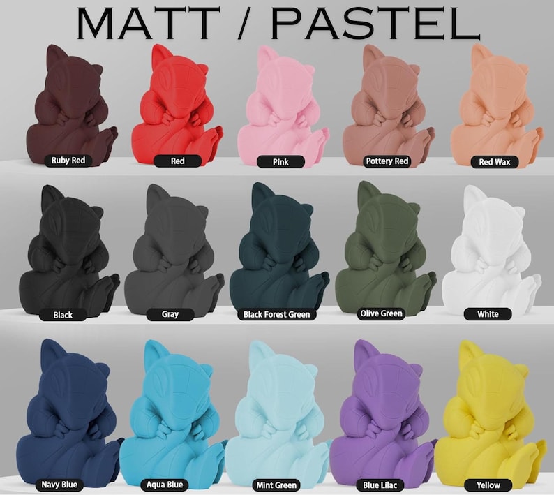May include: A collection of 15 small, hand-painted figurines in various colors, including red, pink, black, gray, green, white, blue, and yellow. Each figurine is in the shape of a cartoon animal with a curled tail and a sleeping expression. The figurines are arranged in three rows of five, with the colors of each row changing from left to right. The text "MATT / PASTEL" is displayed at the top of the image.