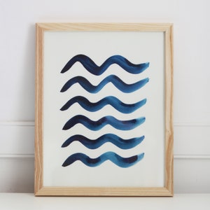 May include: A framed print with a white background and five blue watercolor waves.