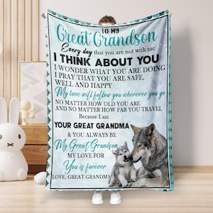 May include: A teal and white blanket with a wolf and wolf pup design. The blanket has a message that reads "To my Great Grandson Every day that you are not with me I THINK ABOUT YOU I WONDER WHAT YOU ARE DOING I PRAY THAT YOU ARE SAFE, WELL AND HAPPY My love will follow you wherever you go NO MATTER HOW OLD YOU ARE AND NO MATTER HOW FAR YOU TRAVEL Because I am YOUR GREAT GRANDMA & YOU ALWAYS BE My Great Grandson MY LOVE FOR You is forever LOVE, GREAT GRANDMA"