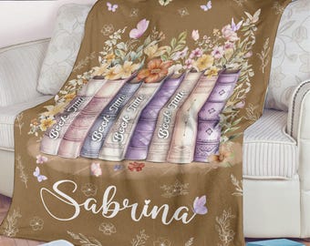 Manta de libro personalizada, título de libros personalizados y manta de nombre para amante de los libros, manta de libro favorito, decoración de regalo de cumpleaños nerd de libro floral