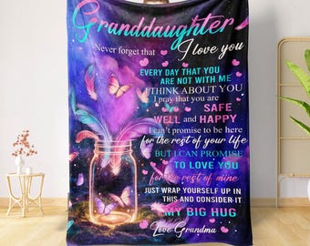 May include: Purple and blue fleece blanket with a galaxy design and butterflies. The text on the blanket reads "Granddaughter Never forget that I love you Every day that you are not with me I think about you I pray that you are safe well and happy I can't promise to be here for the rest of your life but I can promise to love you for the rest of mine Just wrap yourself up in this and consider it my big hug Love Grandma".