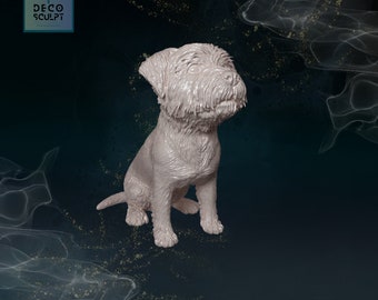May include: A white ceramic sculpture of a small dog sitting with its head tilted up. The dog has a fluffy coat and a sweet expression.