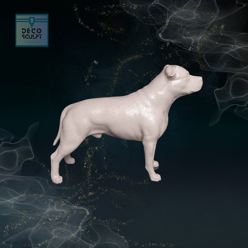 May include: A white, 3D printed model of a Staffordshire Bull Terrier dog standing on a dark blue background.