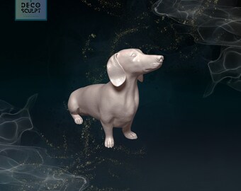 May include: A white ceramic dachshund figurine with a long snout and floppy ears. The figurine is standing on a dark blue background with a light blue and gold abstract design.