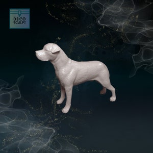 May include: A white ceramic dog figurine standing with its head turned to the side. The dog has a short, smooth coat and a slightly raised tail.