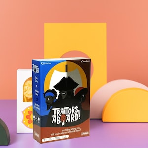 May include: A board game box titled "Traitors Aboard!" features a dark illustration of three figures with hats. The box is blue, brown, and white, with the game's title in large white letters. The text "are hiding among you..." is also visible.