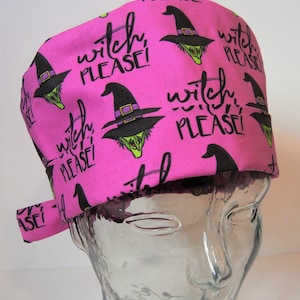 May include: Pink surgical scrub hat with a repeating pattern of witches wearing black hats and the text "witch, please!"