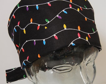 May include: Black scrub hat with a colorful string of lights pattern.