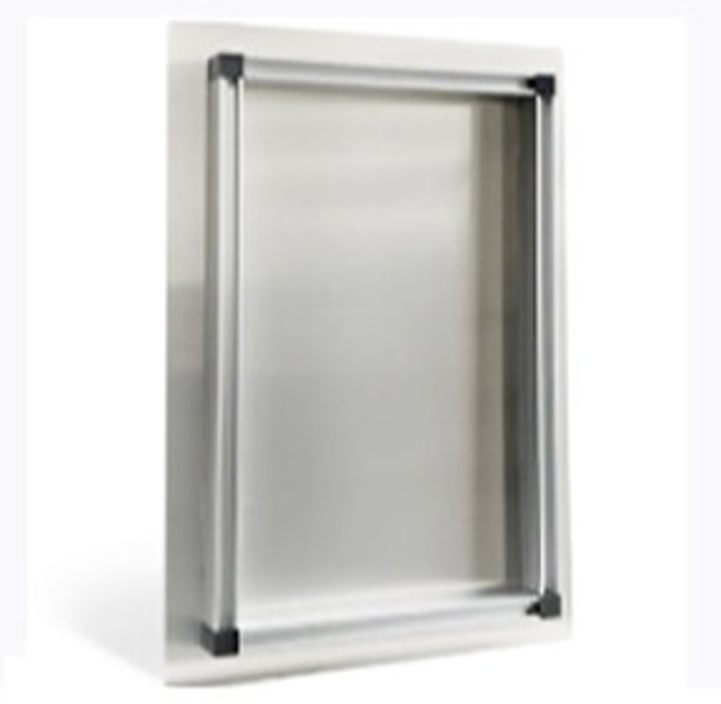 May include: A rectangular, stainless steel pet door with a silver frame and black corner accents. The door is mounted on a white surface, designed for easy pet access.